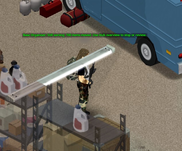 In-game message above the player: Base Organiser still sorting, 100 items moved, use Hub overview to stop or review
